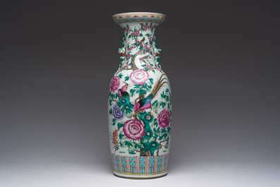 A Chinese famille rose vase with phoenixes and pheasants among blossoming branches, 19th C.