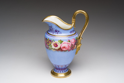 A Louis Philippe S&egrave;vres porcelain ewer with floral design on a blue ground, blue star mark, dated 1832