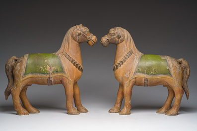 Two Indian partly polychromed wooden sculptures of horses, 20th C.