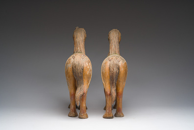 Two Indian partly polychromed wooden sculptures of horses, 20th C.