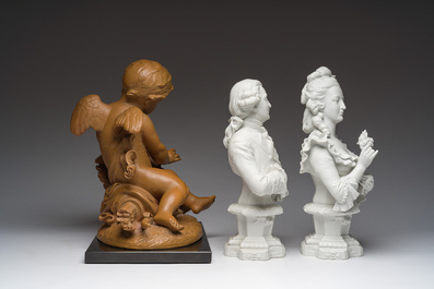 A pair of biscuit busts of Louis XVI and Marie-Antoinette and a patinated 'Cupid' group after Pigalle, 19th/20th C.