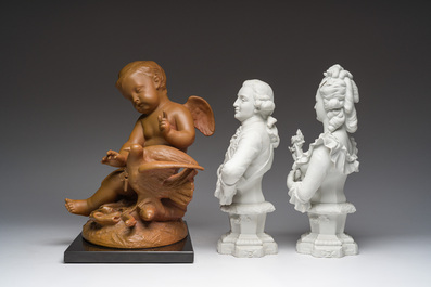 A pair of biscuit busts of Louis XVI and Marie-Antoinette and a patinated 'Cupid' group after Pigalle, 19th/20th C.