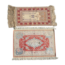 Two Turkish Hereke silk rugs with animals and floral design, 20th C.