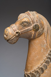 Two Indian partly polychromed wooden sculptures of horses, 20th C.