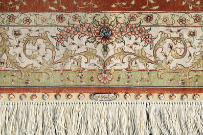 Two Turkish Hereke silk rugs with animals and floral design, 20th C.