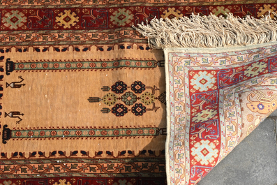 Two Turkish Hereke silk rugs with animals and floral design, 20th C.