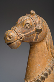 Two Indian partly polychromed wooden sculptures of horses, 20th C.