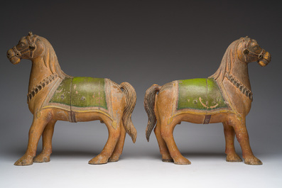 Two Indian partly polychromed wooden sculptures of horses, 20th C.