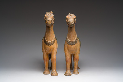 Two Indian partly polychromed wooden sculptures of horses, 20th C.