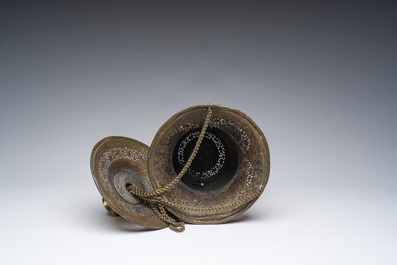 An engraved and reticulated brass Mamluk style hanging lantern, Egypt or Syria, 19th C.