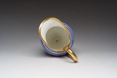 A Louis Philippe S&egrave;vres porcelain ewer with floral design on a blue ground, blue star mark, dated 1832