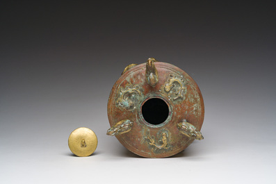 A Chinese parcel-gilt copper tripod 'zun' archaic vessel, probably 17th/18th C.