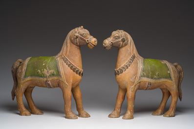 Two Indian partly polychromed wooden sculptures of horses, 20th C.