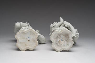 A pair of biscuit busts of Louis XVI and Marie-Antoinette and a patinated 'Cupid' group after Pigalle, 19th/20th C.