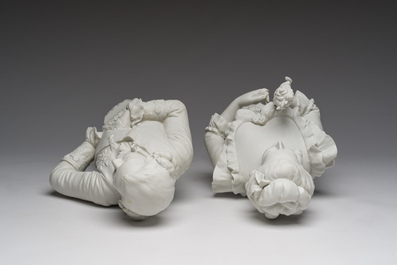 A pair of biscuit busts of Louis XVI and Marie-Antoinette and a patinated 'Cupid' group after Pigalle, 19th/20th C.