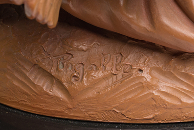 A pair of biscuit busts of Louis XVI and Marie-Antoinette and a patinated 'Cupid' group after Pigalle, 19th/20th C.