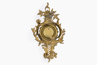 A French gilt bronze Louis XV style cartel clock with floral design, 19th/20th C.