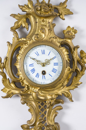 A French gilt bronze Louis XV style cartel clock with floral design, 19th/20th C.