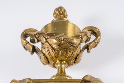 A French gilt bronze Louis XVI style cartel clock with a mascaron and floral design, Collin &agrave; Paris, 19th C.