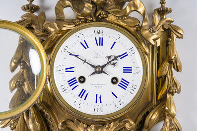 A French gilt bronze Louis XVI style cartel clock with a mascaron and floral design, Collin &agrave; Paris, 19th C.