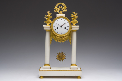 A French Neoclassical gilt bronze mounted white marble portico clock, 19th C.