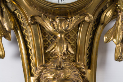A French gilt bronze Louis XVI style cartel clock with a mascaron and floral design, Collin &agrave; Paris, 19th C.