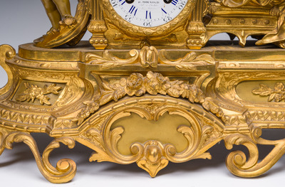 A French gilt bronze three-piece clock garniture with Erato, playful putti and S&egrave;vres style plaques, 19th C.