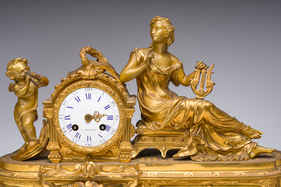 A French gilt bronze three-piece clock garniture with Erato, playful putti and S&egrave;vres style plaques, 19th C.