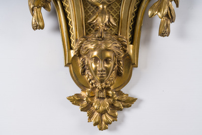 A French gilt bronze Louis XVI style cartel clock with a mascaron and floral design, Collin &agrave; Paris, 19th C.