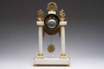 A French Neoclassical gilt bronze mounted white marble portico clock, 19th C.