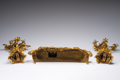 A French gilt bronze three-piece clock garniture with Erato, playful putti and S&egrave;vres style plaques, 19th C.