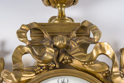 A French gilt bronze Louis XVI style cartel clock with a mascaron and floral design, Collin &agrave; Paris, 19th C.