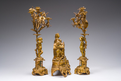A French gilt bronze three-piece clock garniture with Erato, playful putti and S&egrave;vres style plaques, 19th C.