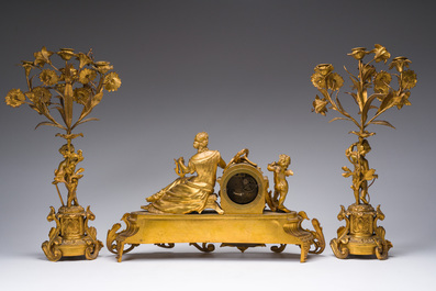A French gilt bronze three-piece clock garniture with Erato, playful putti and S&egrave;vres style plaques, 19th C.