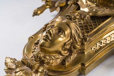 A French gilt bronze Louis XVI style cartel clock with a mascaron and floral design, Collin &agrave; Paris, 19th C.