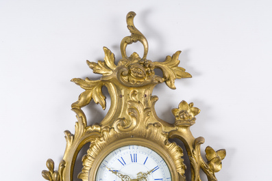 A French gilt bronze Louis XV style cartel clock with floral design, 19th/20th C.