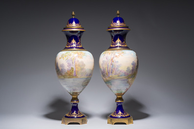 Een paar grote S&egrave;vres porseleinen vazen met allegorie&euml;n van 'De oogst' en 'De visvangst' op verguld bronzen monturen, Frankrijk, 19de eeuw