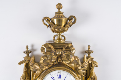 A French gilt bronze Louis XVI style cartel clock with a mascaron and floral design, Collin &agrave; Paris, 19th C.