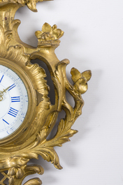 A French gilt bronze Louis XV style cartel clock with floral design, 19th/20th C.