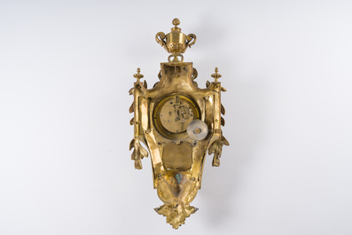 A French gilt bronze Louis XVI style cartel clock with a mascaron and floral design, Collin &agrave; Paris, 19th C.
