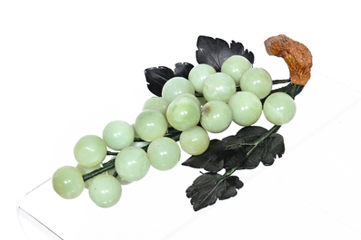 Sixteen Chinese green jade and hardstone sculptures, 20th C.