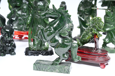 Sixteen Chinese green jade and hardstone sculptures, 20th C.