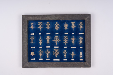 21 silver Tuareg pendants and two Koran boxes in silver and copper, Nigeria, Mali and Morocco, 19th/20th C.