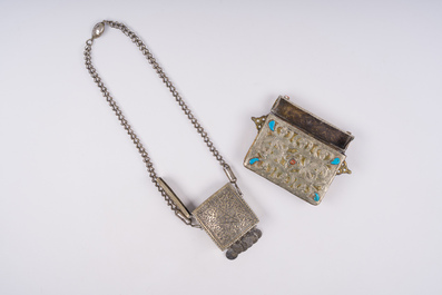 21 silver Tuareg pendants and two Koran boxes in silver and copper, Nigeria, Mali and Morocco, 19th/20th C.