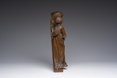 A Flemish oak group depicting Saint Anne teaching Mary to read, 19th C.