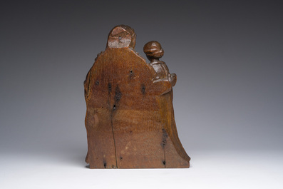 A Flemish oak group depicting Saint Anne teaching Mary to read, 19th C.