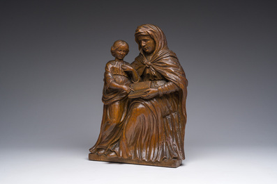 A Flemish oak group depicting Saint Anne teaching Mary to read, 19th C.