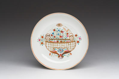 A Chinese famille rose 'flower basket' cup and saucer, Qianlong