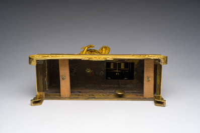 A fine French gilt bronze mantel clock crowned with a writing lady, 19th C.