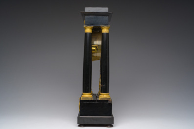 A French bronze mounted ebonized wooden column mantel clock, 19th C.